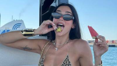 Dua Lipa Sizzles in a Tiny Underboob-Baring Bikini: ‘Having a Good Time’