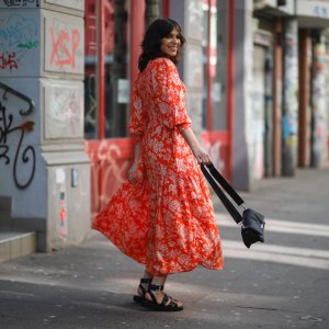 HAMBURG, GERMANY - MARCH 30: Anna Wolfers poses wearing red floral midi dress, black bag and black open toe sandals on March 30, 2021 in Hamburg, Germany. (Photo by Jeremy Moeller/Getty Images)