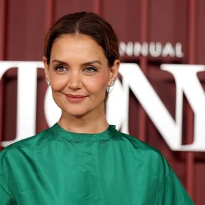 Katie Holmes wearing a green dress
