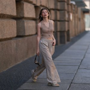 BERLIN, GERMANY - JUNE 05: Sophia Geiss seen wearing a beige ripped top from LeGer, a beige linen wide leg pants from LeGer, beige sandals from Zara and a brown Vintage Fendi bag on June 05, 2022 in Berlin, Germany. (Photo by Jeremy Moeller/Getty Images)