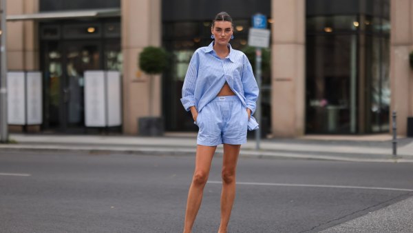 BERLIN, GERMANY - AUGUST 16: Celine Bethmann wearing blue striped Worst Behavior two piece and white Stradivarius heels on August 16, 2021 in Berlin, Germany. (Photo by Jeremy Moeller/Getty Images)