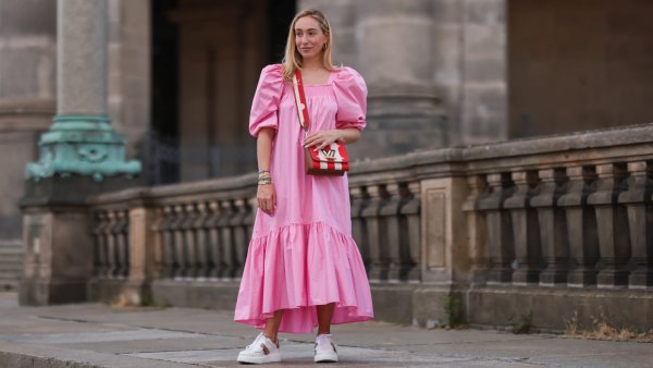 BERLIN, GERMANY - JULY 06: Sonia Lyson wearing Louis Vuitton bag, white Dior ID sneakers and pink H&M maxi dress on July 06, 2021 in Berlin, Germany. (Photo by Jeremy Moeller/Getty Images)
