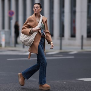 BERLIN, GERMANY - NOVEMBER 09: Celine Bethmann seen wearing gold earrings, Ralph Lauren beige wool teddy knit sweater, Liu Jo brown wool short coat, COS cream white crossbody bag, Zara blue denim jeans / pants, UGG chestnut / brown suede leather platform boots, on November 09, 2023 in Berlin, Germany. (Photo by Jeremy Moeller/Getty Images)