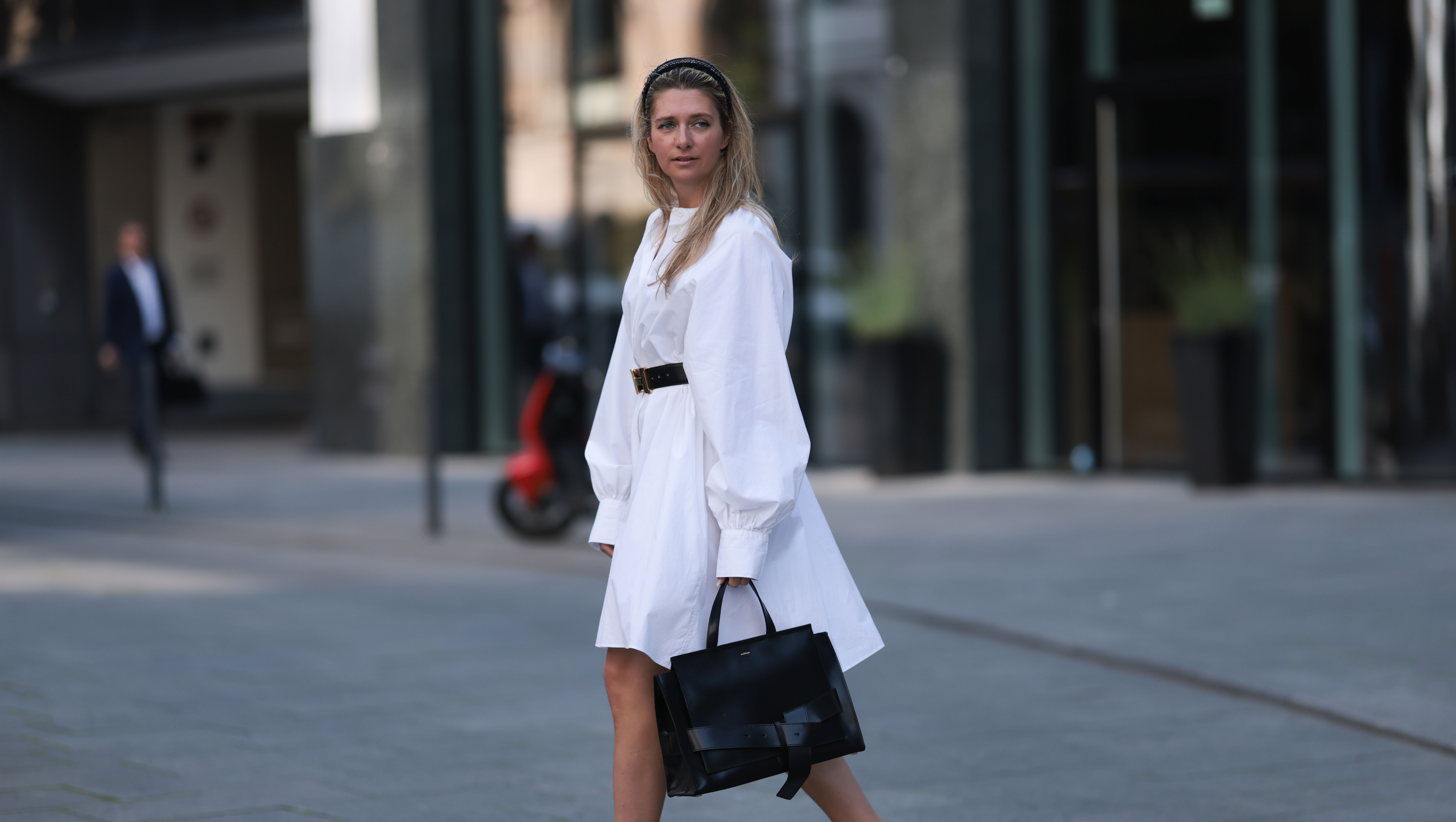 HAMBURG, GERMANY - JUNE 08: Josephine Kröger wearing black Hermes belt, black Saint Laurent heels, white SoSue dress, black naditum bag on June 08, 2023 in Hamburg, Germany. (Photo by Jeremy Moeller/Getty Images)