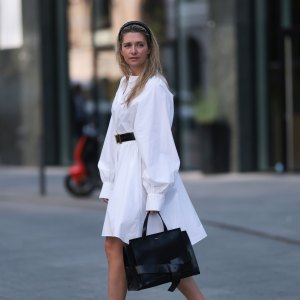 HAMBURG, GERMANY - JUNE 08: Josephine Kröger wearing black Hermes belt, black Saint Laurent heels, white SoSue dress, black naditum bag on June 08, 2023 in Hamburg, Germany. (Photo by Jeremy Moeller/Getty Images)