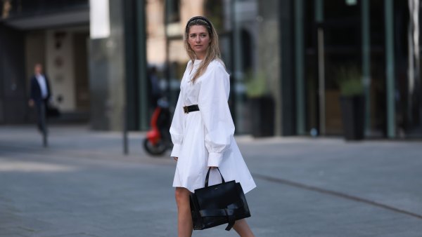 HAMBURG, GERMANY - JUNE 08: Josephine Kröger wearing black Hermes belt, black Saint Laurent heels, white SoSue dress, black naditum bag on June 08, 2023 in Hamburg, Germany. (Photo by Jeremy Moeller/Getty Images)