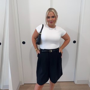 Olivia Hanson in white T-shirt and black shorts