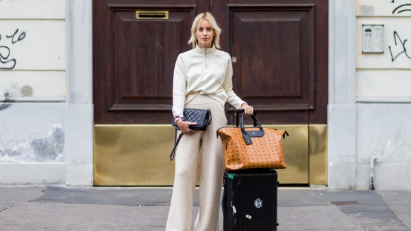 MILAN, ITALY - SEPTEMBER 22: Lisa Hahnbeuck (@lisarvd) wearing an Athleisure Look, Reebock sweater, Knit Pants Molli, bag Rimowa and MCM Nomad Travel Bag, Adiletten, Chanel Boy Bag outside Fendi during Milan Fashion Week Spring/Summer 2017 on September 22, 2016 in Milan, Italy. (Photo by Christian Vierig/Getty Images)