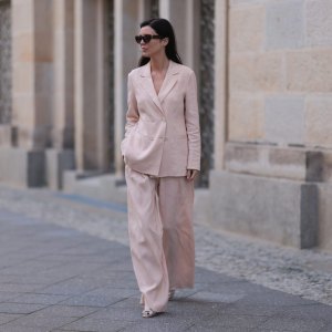 BERLIN, GERMANY - FEBRUARY 25: Leo Eberlin seen wearing YSL brown tortoise sunglasses, Leo Mathild diamond jewelry / rings and bracelet, Marc Cain light pink elegant blazer jacket, matching Marc Cain light pink elegant wide leg suit pants and Marc Cain silver leather heels, on February 25, 2024 in Berlin, Germany. (Photo by Jeremy Moeller/Getty Images)