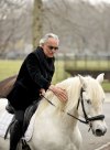 Andrea Bocelli opens a horse