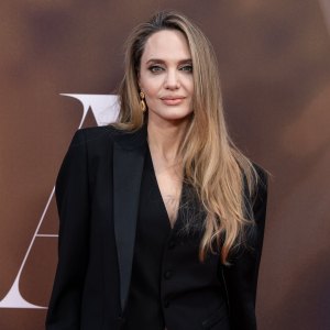 Angelina Jolie Debuts Icy Blonde Bob With Bold Red Lip While Filming Anxious People Alongside Son Maddox