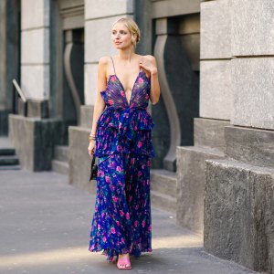 MILAN, ITALY - FEBRUARY 22: Leonie Hanne wears a blue ruffled dress with pink floral print, a black Jacquemus mini bag, outside Philosophy, during Milan Fashion Week Fall/Winter 2020-2021 on February 22, 2020 in Milan, Italy. (Photo by Edward Berthelot/Getty Images)