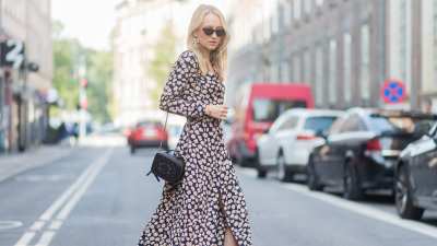 COPENHAGEN, DENMARK - AUGUST 09: Juliane Diesner wearing Ganni dress with floral print, Chanel bag, Balenciaga boots on August 09, 2017 in Copenhagen, Denmark. (Photo by Christian Vierig/Getty Images)