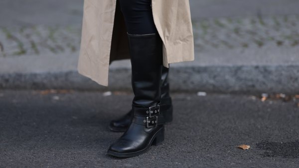 BERLIN, GERMANY - APRIL 17: Sophia Geiss seen wearing LeGer black cotton form-fitting leggings, Cos long, beige oversized trench coat with oversized lapels and a relaxed structure and & Other Stories black leather knee-high boots with a modest heel, adding a bit of edge and sophistication, on April 17, 2025 in Berlin, Germany. (Photo by Jeremy Moeller/Getty Images)