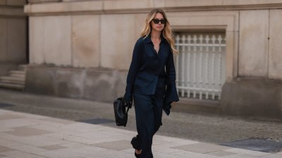 HAMBURG, GERMANY - JUNE 09: Liesa Späht seen wearing black sunglasses from Celine, a dark blue silk blouse from SoSue, a matching dark blue silk wide leg pants from SoSue, black heels from Saint Laurent and a black leather Khaite bag on June 09, 2022 in Hamburg, Germany. (Photo by Jeremy Moeller/Getty Images)