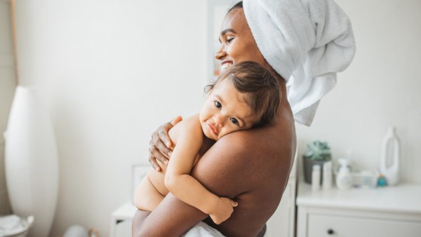 Mother and baby girl enjoying in their time after bath.