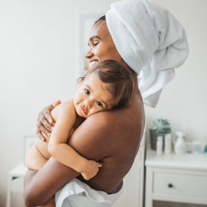 Mother and baby girl enjoying in their time after bath.