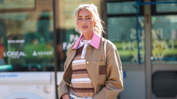 PARIS, FRANCE - MARCH 05: Emili Sindlev wears gold earrings, light pink t-shirt, light brown dark brown white striped polo shirt, dark brown dark pink leather collar oversized Casablanca jacket, outside Casablanca, during the Paris Fashion week Women's Fall/Winter 2025-2026 on March 5, 2025 in Paris, France. (Photo by Edward Berthelot/Getty Images)