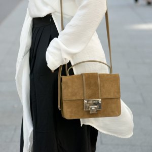 PARIS, FRANCE - OCTOBER 3: Fashion Blogger Julia Haghjoo wears a Asos top, Tibi trousers, and Jimmy Choo bag on day 5 during Paris Fashion Week Spring/Summer 2016/17 on October 3, 2015 in Paris France. (Photo by Kirstin Sinclair/Getty Images)