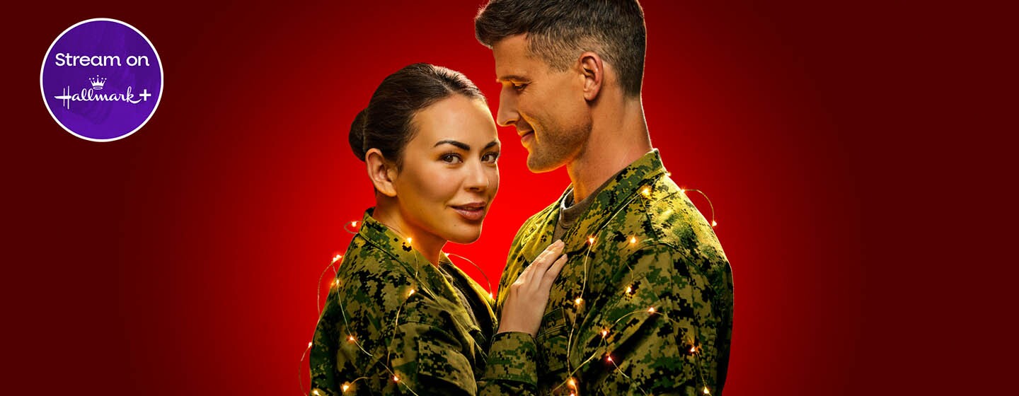 Janel Parrish and Parker Young in Christmas on Duty