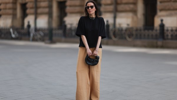 HAMBURG, GERMANY - MAY 09: Elise Seitz seen wearing a Bottega Veneta Jodie black leather bag, Isabel Marant black boots, Soho Studios black shirt and beige and brown pants and Ace and Tate black shades on May 09, 2023 in Hamburg, Germany. (Photo by Jeremy Moeller/Getty Images)