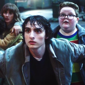 Winona Ryder as Joyce Byers, Finn Wolfhard as Mike Wheeler and Jake Connelly as Derek in Stranger Things season 4