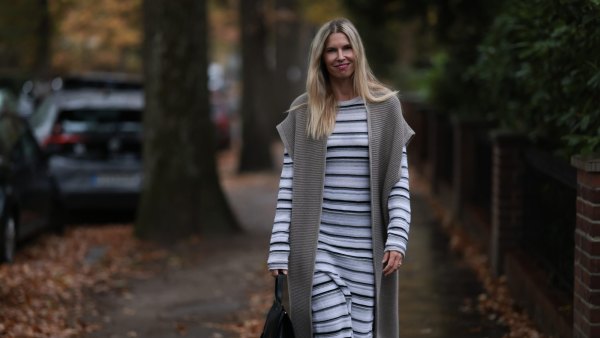 HAMBURG, GERMANY - NOVEMBER 17: Vanessa Giers seen wearing SoSUE Laura black and white knit dress ,SoSUE Knit Cosy Azteco beige vest, Naditum black leather handbag, & other stories black boots on November 17, 2022 in Hamburg, Germany. (Photo by Jeremy Moeller/Getty Images)