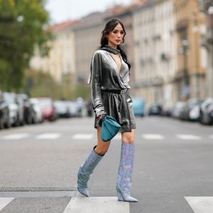 MILAN, ITALY - SEPTEMBER 20: Heart Evangelista wears a gray satin shiny / silver / lustrous gathered puffy mini / short dress, a blue bag, knee-high sequin shiny pointed boots, outside Alberta Ferretti, during the Milan Fashion Week - Womenswear Spring/Summer 2024 on September 20, 2023 in Milan, Italy. (Photo by Edward Berthelot/Getty Images)
