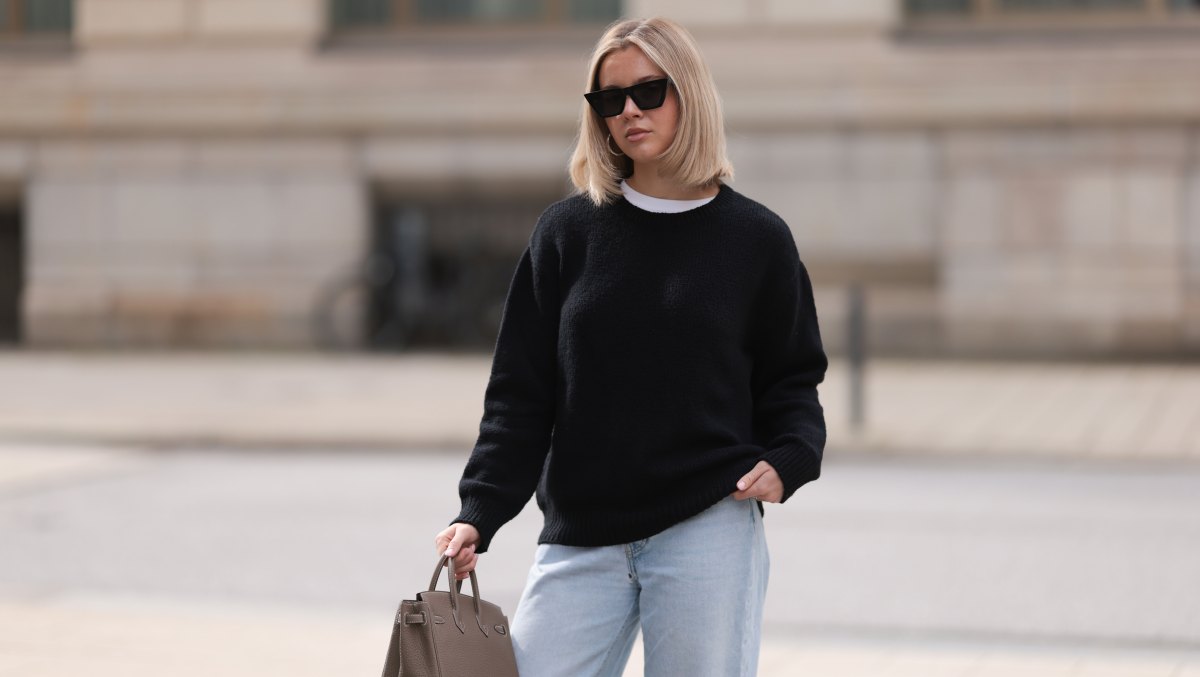 HAMBURG, GERMANY - APRIL 05: Isabelle Hartmann seen wearing Celine black sunglasses, Almada Label black cashmere wool knit sweater, Levi’s light blue vintage denim and Hermès Birkin 25 brown / taupe leather handbag on April 05, 2024 in Hamburg, Germany. (Photo by Jeremy Moeller/Getty Images)