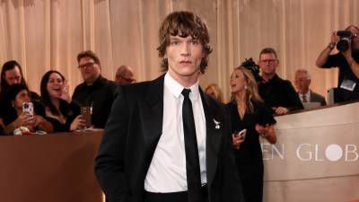 'Heated Rivalry' Star Connor Storrie Debuts Shaggy Hair on 2026 Golden Globes Awards Red Carpet