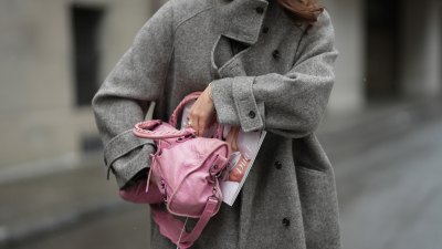 New Handbags MUNICH, GERMANY - JANUARY 8: Amanda Mühle is seen wearing a grey wool coat with wide lapels, button closure and buttoned collar from Siyazu; a pink leather Balenciaga “City bag” with a softly slouched shape, top handles and silver hardware from Balenciaga; multiple silver rings from Pilgrim; holding a Vogue Magazine on January 8, 2026 in Munich, Germany.