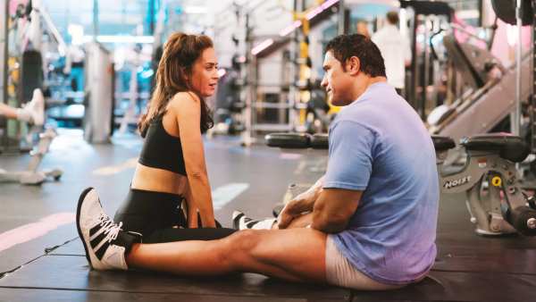 Emily Blunt as Dawn Staples, Dwayne Johnson as Mark Kerr in The Smashing Machine