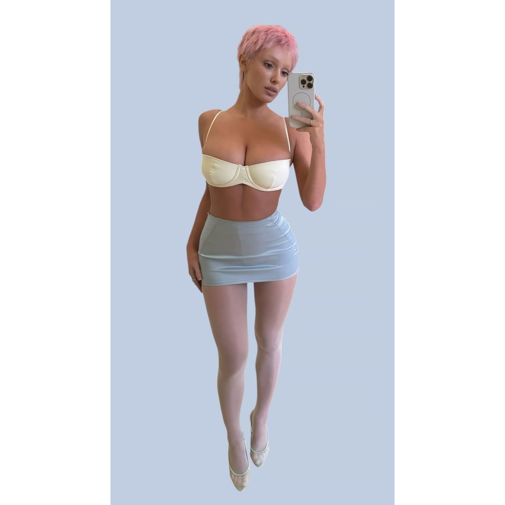 Bianca Censori Debuts Pink Pixie Hair in a Daring Crop Top and Micro Mini Skirt