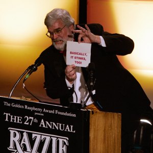 Presenter John Wilson announces the winn - The Razzies Cocreator Spills Secrets About Awards Show Ahead of 2026 Event