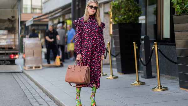 OSLO, NORWAY - AUGUST 22: Annabel Rosendahl wearing a red dress, sock boots with floral print outside byTiMo on August 22, 2017 in Oslo, Norway. (Photo by Christian Vierig/Getty Images)