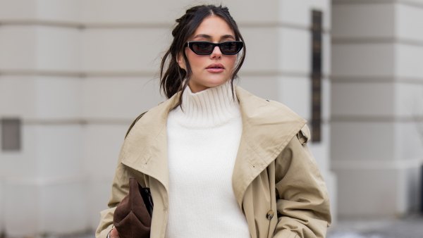 BERLIN, GERMANY - FEBRUARY 01: Aylin Sengül wears white jeans & beige trench coat Arket, turtleneck Cos, sunglasses YSL, loafers H&M, brown suede bag Demellier London during the Berlin Fashion Week Autumn/Winter 2026 at on February 01, 2026 in Berlin, Germany. (Photo by Christian Vierig/Getty Images)