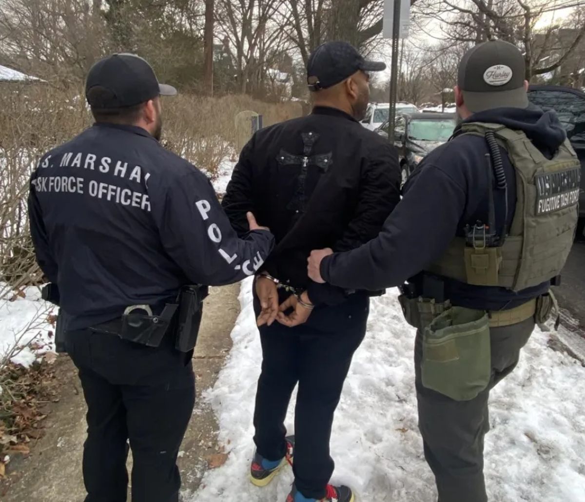 A photo shows the arrest of Michael Robinson