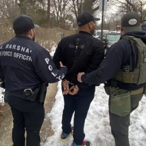 A photo shows the arrest of Michael Robinson