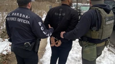 A photo shows the arrest of Michael Robinson