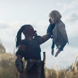 Dimitrius Schuster-Koloamatangi and Elle Fanning in Predator: Badlands