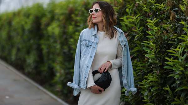 HAMBURG, GERMANY - JUNE 03: Elise Soho wearing beige Baige dress, blue Topman denim jacket and black Bottega Veneta mini leather bag on June 03, 2021 in Hamburg, Germany. (Photo by Jeremy Moeller/Getty Images)