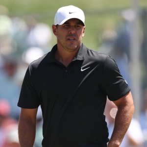 GettyImages-2267717697 Brooks Koepka consoles young girl trapped under golf cart