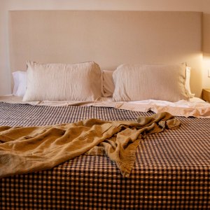 Cozy room with double bed - stock photo