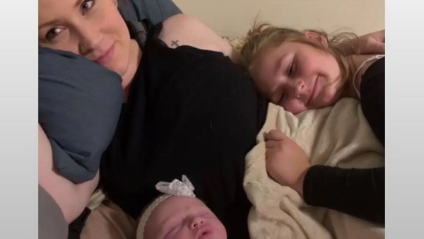 A photo of the mother and her two daughters