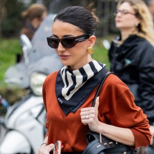 MILAN, ITALY - FEBRUARY 27: Alexandra Pereira wears black leather skirt, scarf, v neck, bag outside Tods during the Milan Fashion Week - Womenswear Fall/Winter 2026/2027 on February 27, 2026 in Milan, Italy. (Photo by Christian Vierig/Getty Images)
