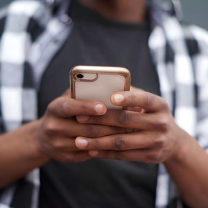 Person using an AirTalk Wireless smartphone for daily tasks