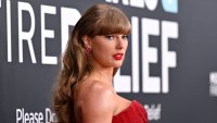 Taylor Swift posing on a red carpet.