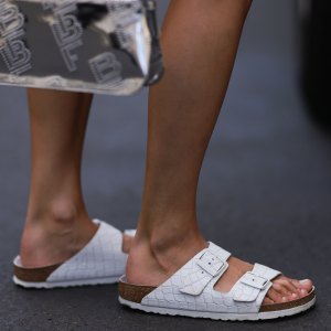 BERLIN, GERMANY - AUGUST 06: Anna Winter wearing Birkenstock white sandals, by Far silver shiny logo bag on August 06, 2022 in Berlin, Germany. (Photo by Jeremy Moeller/Getty Images)