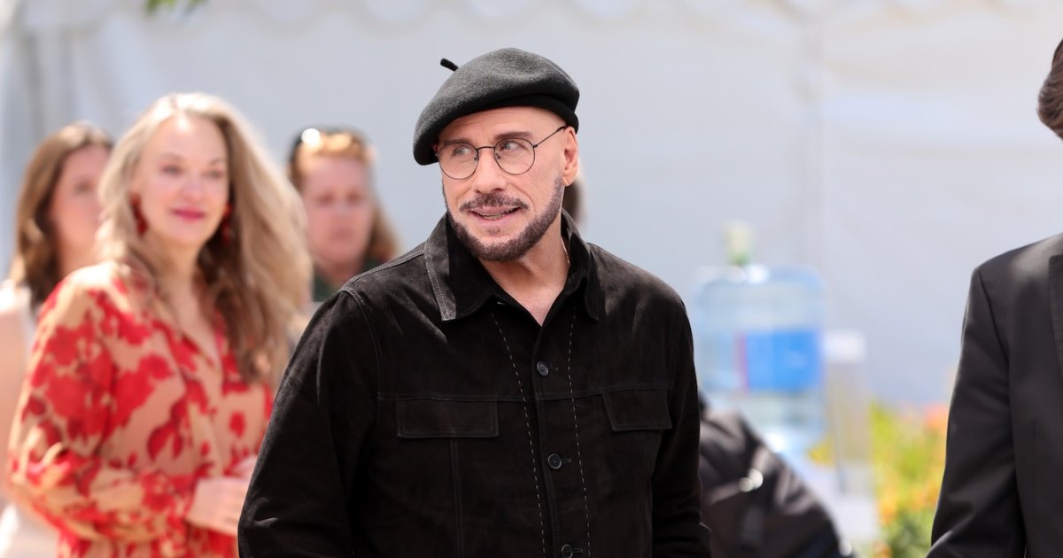 John Travolta Addresses Viral Cannes Look With Beret and Glasses: ‘Going to Play the Part’ John Travolta Addresses Viral Cannes Look With Beret and Glasses: ‘Going to Play the Part’