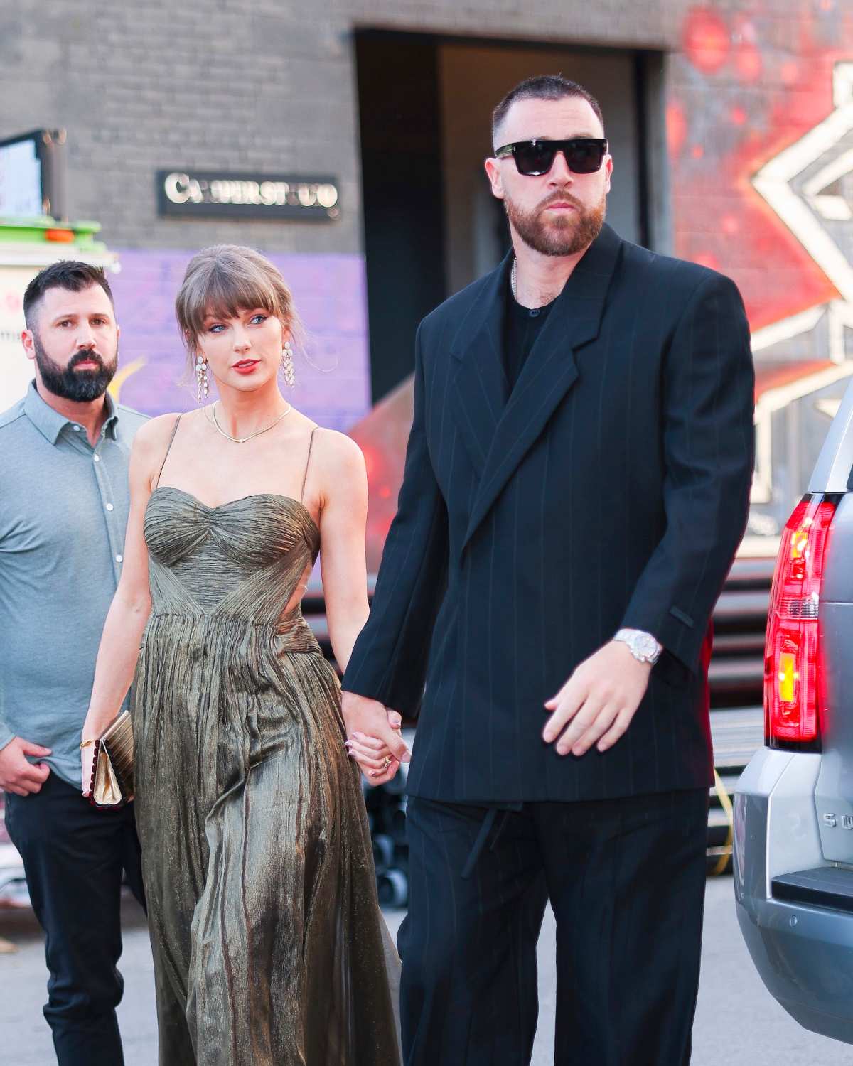 GettyImages-2276630910-Taylor-Swift-Snaps-Selfies-as-Travis-Kelces-Date-at-Wedding.jpg